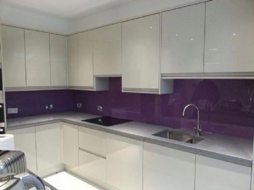 cream gloss kitchen with gray tiles